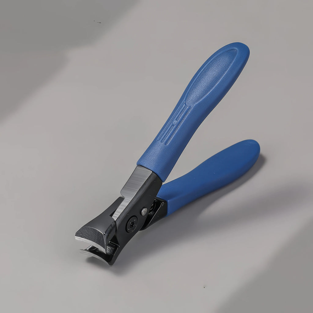 Blue-handled nail clipper on a gray background