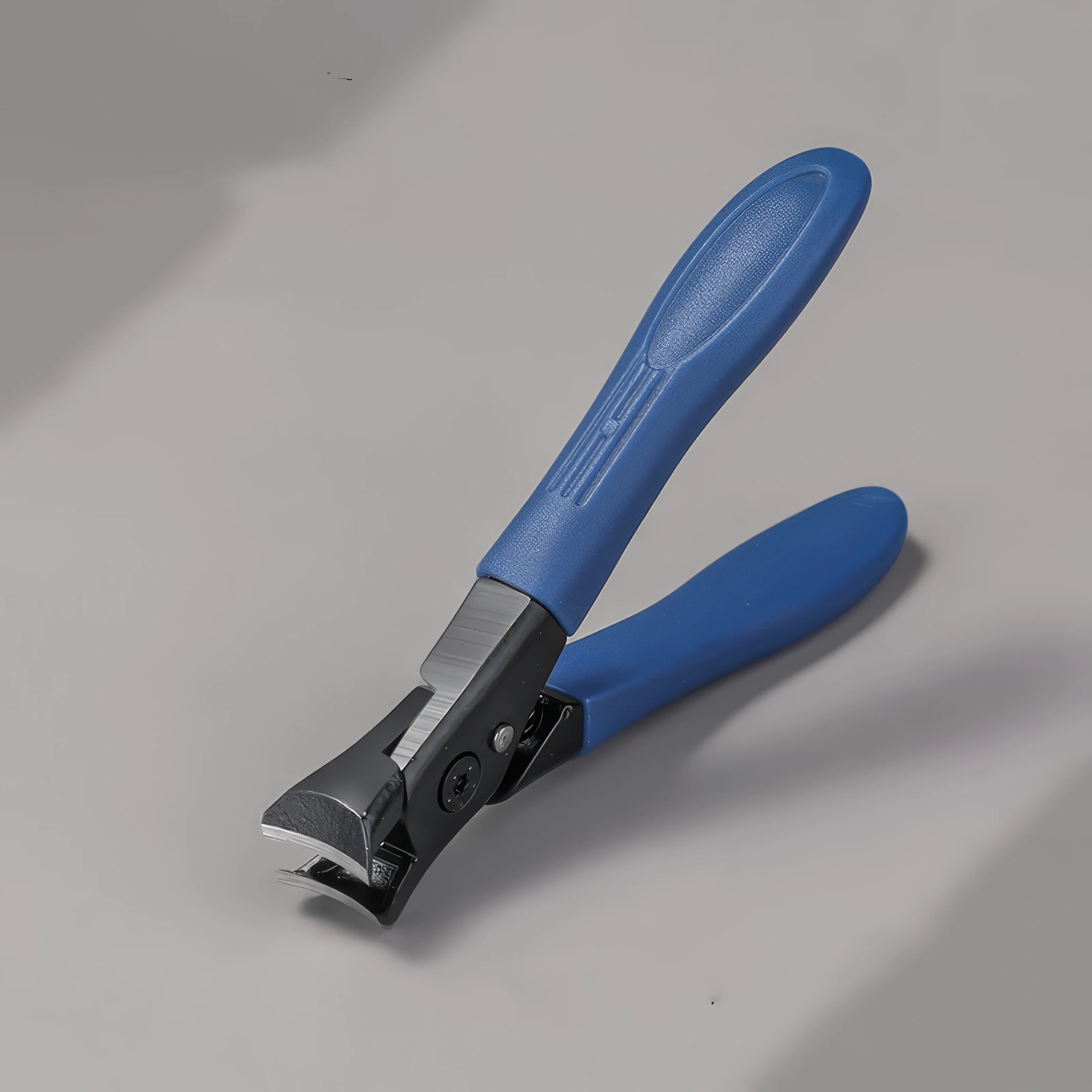 Blue-handled nail clipper on a gray background