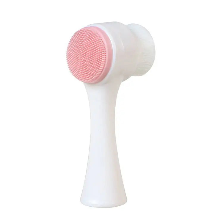 White facial cleansing brush with pink bristle head on a white background