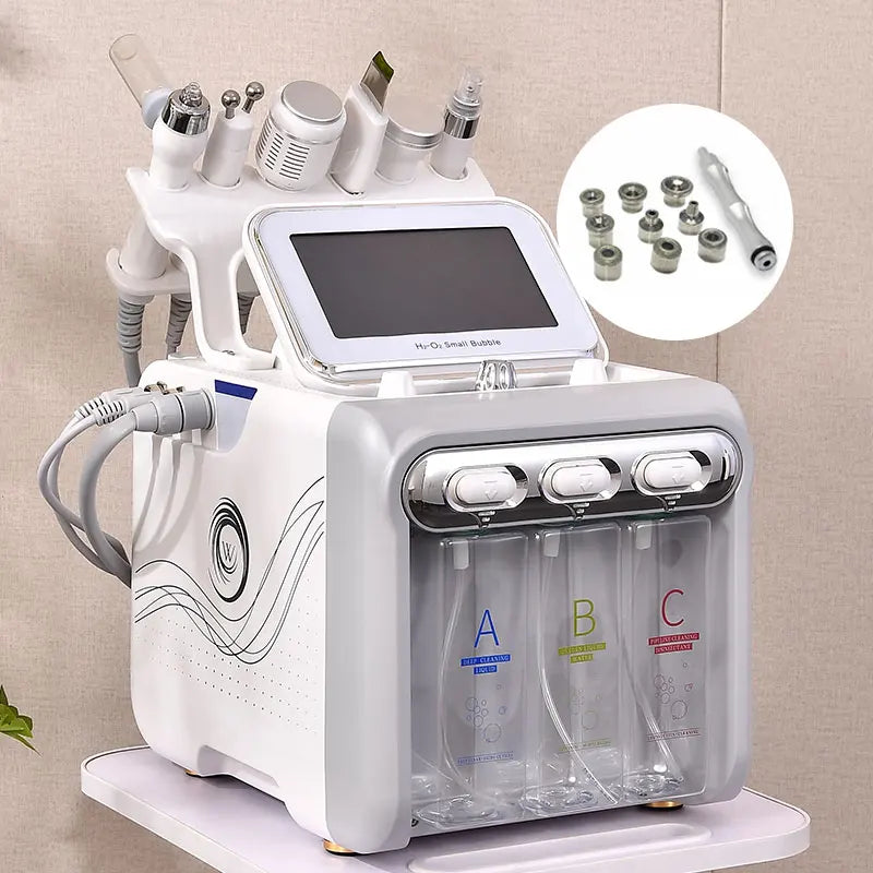 White skincare machine with attachments on a beige background